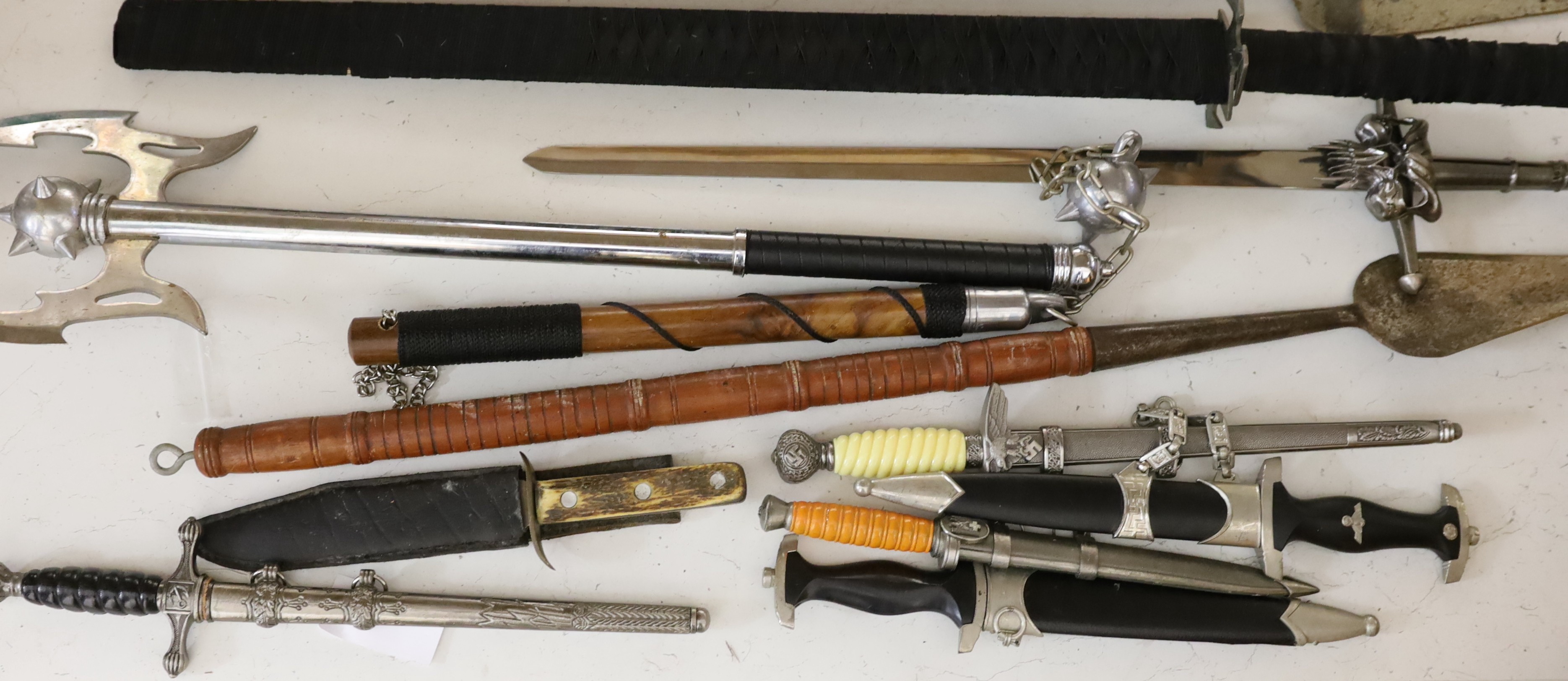 A group of reproduction swords and weapons
